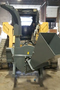 BX42 wood chipper attachment side view
Front-facing view of skid steer wood chipper BX42
Close-up of BX42 hydraulic chute and rotor
Rear view showing input hopper and feed
Mounted BX42 chipper on skid steer