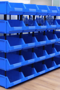 Durable blue plastic storage bins for garages and workshops