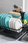 Compact stainless steel dish rack with white bowls and plates

Close-up of drainboard draining water into sink

Side view of dish rack showing utensil holder

All parts of dish rack laid out for assembly

Stainless steel rack in modern kitchen setting