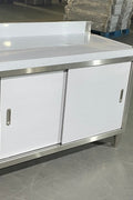 Stainless steel workbench with sliding doors front view

Restaurant prep table with built-in storage

Commercial kitchen stainless steel workbench

Side view of sliding door stainless work table

Heavy-duty garage workbench with stainless cabinet