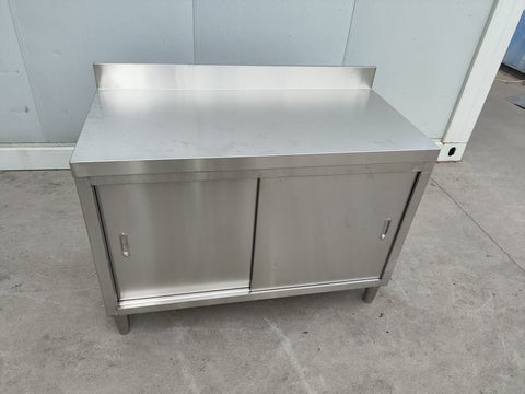 Stainless steel workbench with sliding doors front view

Restaurant prep table with built-in storage

Commercial kitchen stainless steel workbench

Side view of sliding door stainless work table

Heavy-duty garage workbench with stainless cabinet