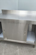 Stainless steel workbench with sliding doors front view

Restaurant prep table with built-in storage

Commercial kitchen stainless steel workbench

Side view of sliding door stainless work table

Heavy-duty garage workbench with stainless cabinet