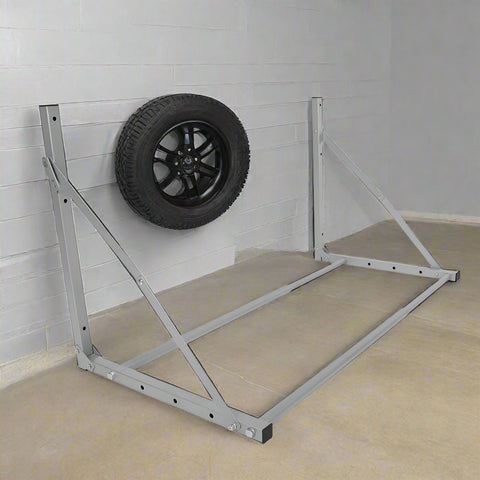 Steel wall-mounted folding tire and wheel storage rack – 300 lb capacity – adjustable width