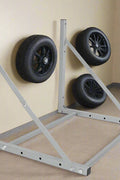 Steel wall-mounted folding tire and wheel storage rack – 300 lb capacity – adjustable width