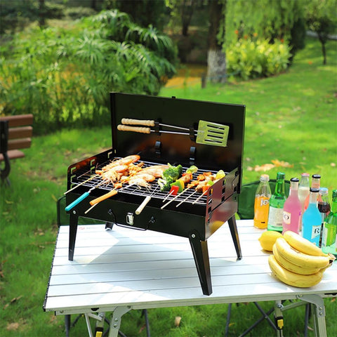 Portable suitcase-style BBQ grill folded open

Compact charcoal grill for travel and camping

Portable BBQ with meat and vegetables on the grill

Folding grill shown in backyard setup

BBQ grill packed for outdoor picnic