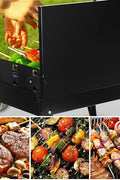 Portable suitcase-style BBQ grill folded open

Compact charcoal grill for travel and camping

Portable BBQ with meat and vegetables on the grill

Folding grill shown in backyard setup

BBQ grill packed for outdoor picnic