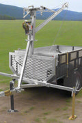 Tandem Axle ATV Off-Road Dump Trailer with Crane and Winch – Model 116501 shown with galvanized dump tub, off-road tires and gear-lifting crane