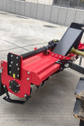 71 inch PTO rotary tiller for tractors
Red 3-point rotary tiller with 42 tines
Side view of heavy-duty tractor tiller attachment
PTO-powered tiller for 40-75 HP tractors
Rear garden rotary tiller with safety guard
Rotary tiller in warehouse – SKU IGN180