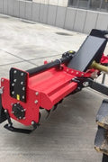 71 inch PTO rotary tiller for tractors
Red 3-point rotary tiller with 42 tines
Side view of heavy-duty tractor tiller attachment
PTO-powered tiller for 40-75 HP tractors
Rear garden rotary tiller with safety guard
Rotary tiller in warehouse – SKU IGN180