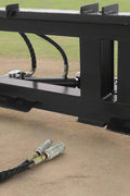 Tree and fence post puller attached to a skid steer
Side view of post puller showing steel jaws and hydraulic cylinder
Top-down view of post puller with open clamp
Puller in action removing small tree from ground
Compact and rugged post puller for skid steer