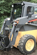 Tree and fence post puller attached to a skid steer
Side view of post puller showing steel jaws and hydraulic cylinder
Top-down view of post puller with open clamp
Puller in action removing small tree from ground
Compact and rugged post puller for skid steer