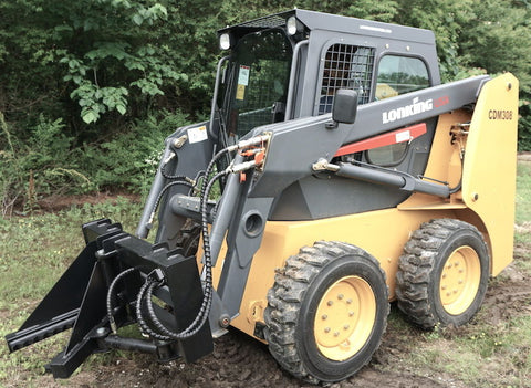 Tree and fence post puller attached to a skid steer
Side view of post puller showing steel jaws and hydraulic cylinder
Top-down view of post puller with open clamp
Puller in action removing small tree from ground
Compact and rugged post puller for skid steer