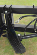 Tree and fence post puller attached to a skid steer
Side view of post puller showing steel jaws and hydraulic cylinder
Top-down view of post puller with open clamp
Puller in action removing small tree from ground
Compact and rugged post puller for skid steer
