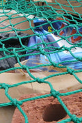 Heavy-Duty Cargo Net Securing Trailer Load – 12x8 ft with Hooks

Green Waste Load Covered by Bungee Truck Net in Trailer

Cargo Net Spread Over Pickup Truck with Reinforced Hooks

Close-Up of Nylon Cargo Net Mesh and Hook Connection

Rolled Heavy-Duty Load Net with Hook Attachments Displayed