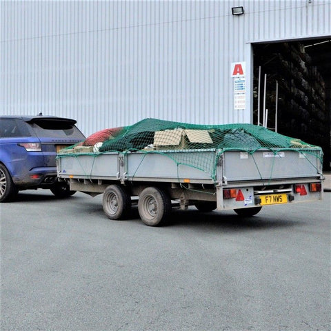Heavy-Duty Cargo Net Securing Trailer Load – 12x8 ft with Hooks

Green Waste Load Covered by Bungee Truck Net in Trailer

Cargo Net Spread Over Pickup Truck with Reinforced Hooks

Close-Up of Nylon Cargo Net Mesh and Hook Connection

Rolled Heavy-Duty Load Net with Hook Attachments Displayed