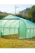 Walk-in dome greenhouse in backyard garden – 20x10x7 size

Peak roof tunnel greenhouse with open flap – front angle

Side view of large greenhouse with roll-up windows

Walk-in greenhouse with anchoring on grass lawn

All-weather plastic greenhouse with steel frame