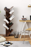 Walnut 8-tier vertical bookshelf with tree-like design

Angled Close-Up: Close-up view of wooden shelf layers and grain texture

Full Shelf with Books: Bookcase filled with books in a home setting

Shelf in Living Room: Walnut bookcase placed in a modern living room

Shelf in Bedroom: Compact wooden bookcase next to bed and décor items