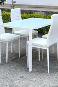 White glass dining table set with 4 chairs in the bright kitchen
Close-up of white glass table and upholstered chair
Side angle of a full 5-piece dining set
White dining chairs around a modern glass table
Dining set outdoors showing full product design
