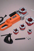 Close-up of portable pipe threading machine and dies for steel plumbing work