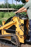 “T380 compact skid steer loader with rubber tracks”

“T460 mini tracked loader for landscaping and excavation”

“Heavy-duty skid steer with universal quick attach plate”

“Tracked compact construction loader in yellow”
