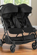 Summer Infant 3Dpac CS+ double stroller in black with car seat compatibility and large canopies
Compact lightweight double stroller with two seats and peekaboo windows
Black twin stroller folded for easy transport
Close-up of stroller seat recline and under-storage basket