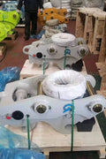 Excavator pin grabber coupler kits organized in warehouse
Yellow hydraulic pin grabber attached to excavator arm